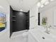 Modern bathroom with a dark tile shower and white vanity at 1024 8Th St, Statesville, NC 28677