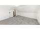Spacious attic bedroom with sloped ceilings and window at 1024 8Th St, Statesville, NC 28677