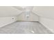 Bright attic bedroom with sloped ceilings and window at 1024 8Th St, Statesville, NC 28677