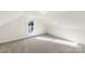 Charming attic bedroom with sloped ceilings and window at 1024 8Th St, Statesville, NC 28677