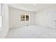 Well-lit bedroom with neutral carpet and a window at 1024 8Th St, Statesville, NC 28677