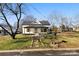Charming renovated farmhouse with front porch and stone walkway at 1024 8Th St, Statesville, NC 28677