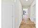 Bright hallway with light wood floors and built-in storage at 1024 8Th St, Statesville, NC 28677