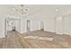 Open living room with hardwood floors and an updated light fixture at 1024 8Th St, Statesville, NC 28677