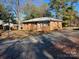 Brick ranch house with a spacious yard and driveway at 103 Willow Dr, Wadesboro, NC 28170