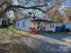 A charming one-story home with a small front yard at 106 Penn St, Monroe, NC 28112