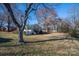 Spacious backyard with mature trees and shed at 209 E Dixon St, Lincolnton, NC 28092