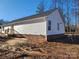 New home showcasing vinyl siding, brick base, and a wooden deck at 301 Cornelius Dr, Rock Hill, SC 29730