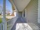 Covered porch with white railings offering curb appeal at 356 Cooper Farm Rd, Statesville, NC 28625