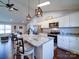 Open concept kitchen with island seating and stainless steel appliances at 356 Cooper Farm Rd, Statesville, NC 28625