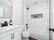 Updated bathroom with marble tile and modern vanity at 505 Cedar Grove Dr, Gastonia, NC 28056