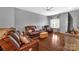 Living room featuring hardwood floors and comfortable seating at 7412 Sienna Heights Pl, Charlotte, NC 28213