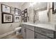 Modern bathroom with gray vanity, quartz countertop, and shower at 10118 Passau Path Dr, Huntersville, NC 28078