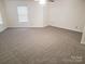 Large bedroom featuring neutral wall paint and carpet at 13926 Lawrence Farm Ln # L49, Charlotte, NC 28278