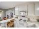 Kitchen with white cabinets and an electric stove at 1459 Erwin St, Lancaster, SC 29720