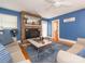 Living room with fireplace, hardwood floors, and blue walls at 202 Mcadenville Rd, Belmont, NC 28012