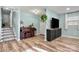 Light-filled living room features hardwood floors, a piano, and built-in entertainment center at 4483 Pinebrook Dr, Rock Hill, SC 29730