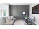 Bright home office features a glass desk, comfortable chairs, and large wall at 5145 Fireweed Ct, Dallas, NC 28034