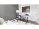 Home office with glass desk, gray walls, and periodic table print at 5145 Fireweed Ct, Dallas, NC 28034