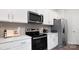 Modern kitchen with stainless steel range and microwave at 5145 Fireweed Ct, Dallas, NC 28034