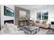 Living area with fireplace, large windows and comfy sofas at 5145 Fireweed Ct, Dallas, NC 28034