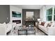 Spacious living room with fireplace, large windows, and comfortable seating at 5145 Fireweed Ct, Dallas, NC 28034