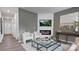 Living room featuring a fireplace, large TV, and comfy seating area at 5145 Fireweed Ct, Dallas, NC 28034