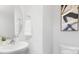 Modern powder room with pedestal sink, decorative mirror, and art at 5145 Fireweed Ct, Dallas, NC 28034