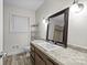 Bathroom boasts granite countertop and updated vanity at 5706 Wadebridge Cv, Charlotte, NC 28210