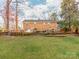 House exterior and expansive backyard with privacy fence at 7527 Gayle Ave, Charlotte, NC 28212