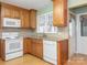 Spacious kitchen with wood cabinets, granite countertops, and white appliances at 926 Bridlepath Ln, Charlotte, NC 28211