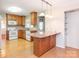 Spacious kitchen with an island, wood cabinets, and granite countertops at 926 Bridlepath Ln, Charlotte, NC 28211