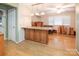 Kitchen island with granite countertop and wood cabinets at 926 Bridlepath Ln, Charlotte, NC 28211