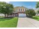 Two-story house with brick and siding, attached garage, and landscaping at 1003 Blue Range Rd, Indian Trail, NC 28079