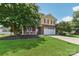 Two-story house with brick and siding, attached garage, and landscaping at 1003 Blue Range Rd, Indian Trail, NC 28079