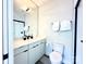 Modern bathroom with a white vanity, toilet and shower at 1228 Minter Pl, Charlotte, NC 28203