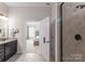 Bathroom features a shower, bedroom access, and vanity at 1385 Rainier Dr, Fort Mill, SC 29708