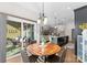 Bright dining area with wooden table and chairs, and view of back patio at 1385 Rainier Dr, Fort Mill, SC 29708