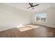 Spacious bedroom with wood floors and large window at 1430 Panther Rd, Lancaster, SC 29720