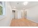 Hardwood floor bedroom with closet and access to hallway at 245 Enwood Dr, Charlotte, NC 28214