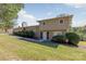 Tan two story house with a grassy yard and trees at 245 Enwood Dr, Charlotte, NC 28214