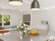 Kitchen island with a gray countertop and modern lighting fixtures at 245 Enwood Dr, Charlotte, NC 28214