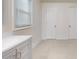 White bathroom vanity with a modern design and an additional door at 246 Barbary Dr, Statesville, NC 28677