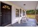 Relaxing rocking chairs on a covered front porch at 364 Scotts Creek Rd, Statesville, NC 28625