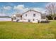 Back exterior view of a ranch house with a yard at 364 Scotts Creek Rd, Statesville, NC 28625