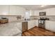 Modern kitchen with white cabinets, stainless steel appliances and granite countertops at 364 Scotts Creek Rd, Statesville, NC 28625