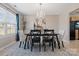 Dining room with chandelier, featuring a formal dining table and chairs at 5732 Cardington Ct, Charlotte, NC 28216