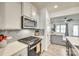 Modern kitchen with gas stove and gray tile backsplash at 932 Canopy Falls Ln, York, SC 29745