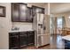 Kitchen with stainless steel refrigerator and dark cabinetry at 12002 Belmont Mansion Dr, Charlotte, NC 28273