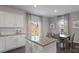 Kitchen island with granite countertop and view of backyard at 1401 6Th Ne St, Hickory, NC 28601